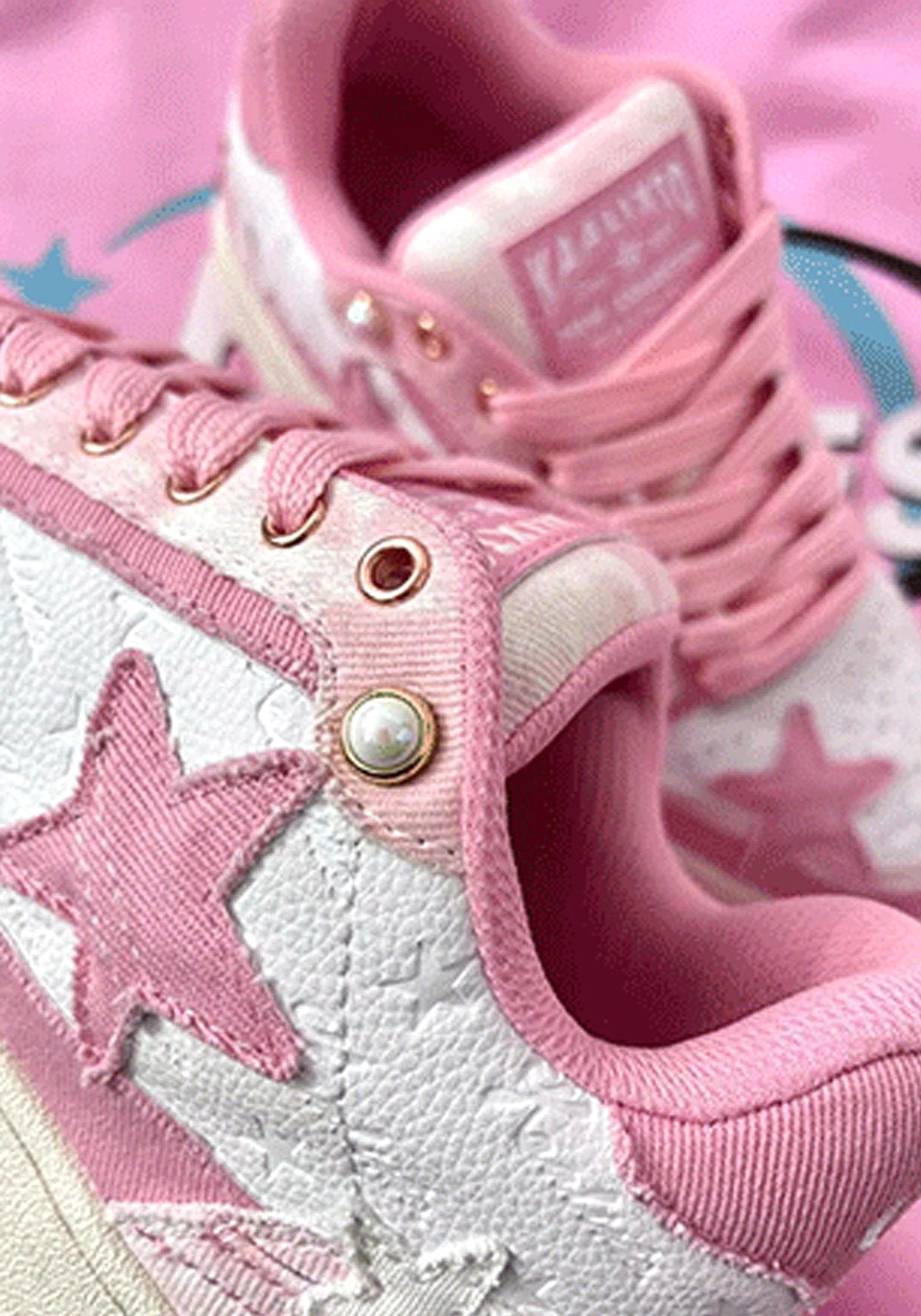 Distressed denim star sneakers worn styling flat-lay composition neutral background streetwear context
