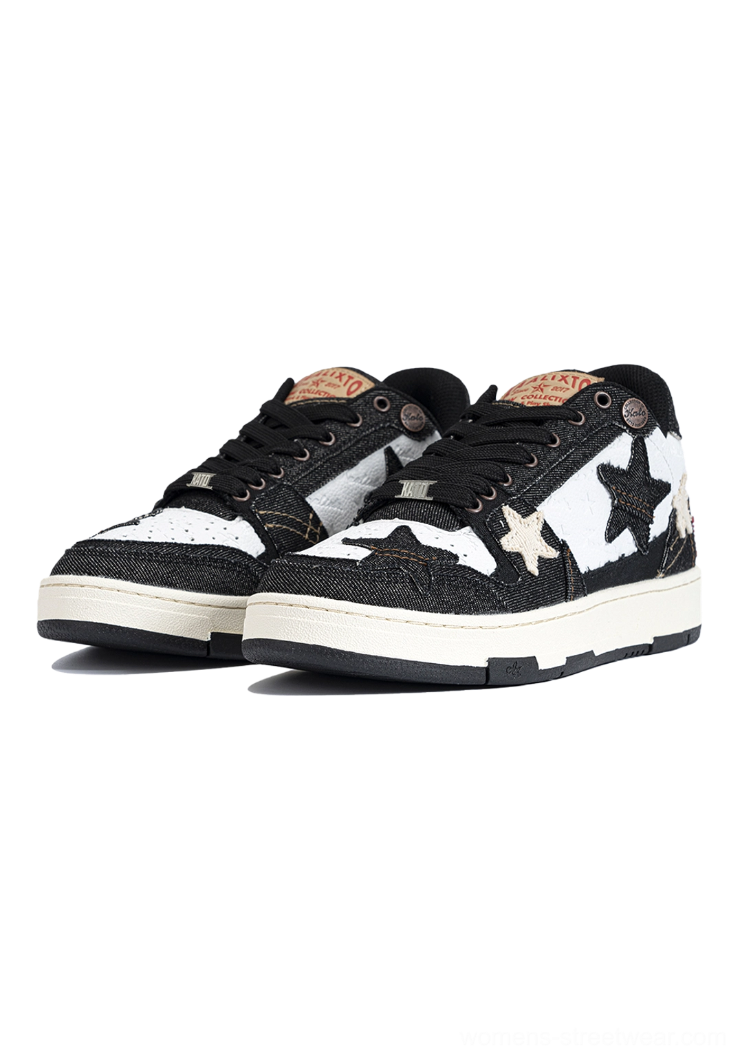 Distressed denim star low-top sneakers paired front three-quarter view white star accents branded heel tab