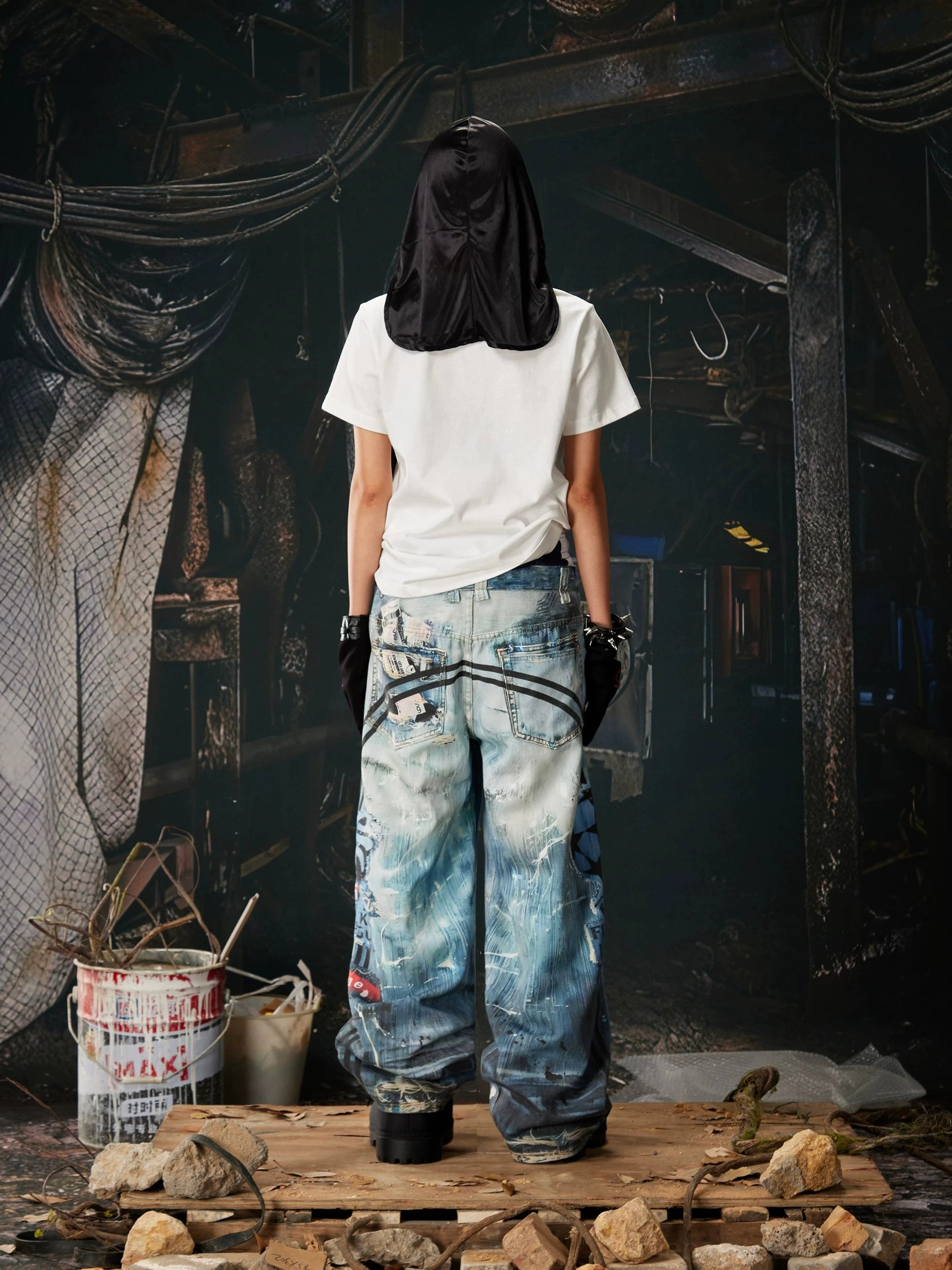 Streetwear distressed wide-leg jeans with blue washed cotton denim, graphic side details, ripped patches, and comfortable adjustable waistband
