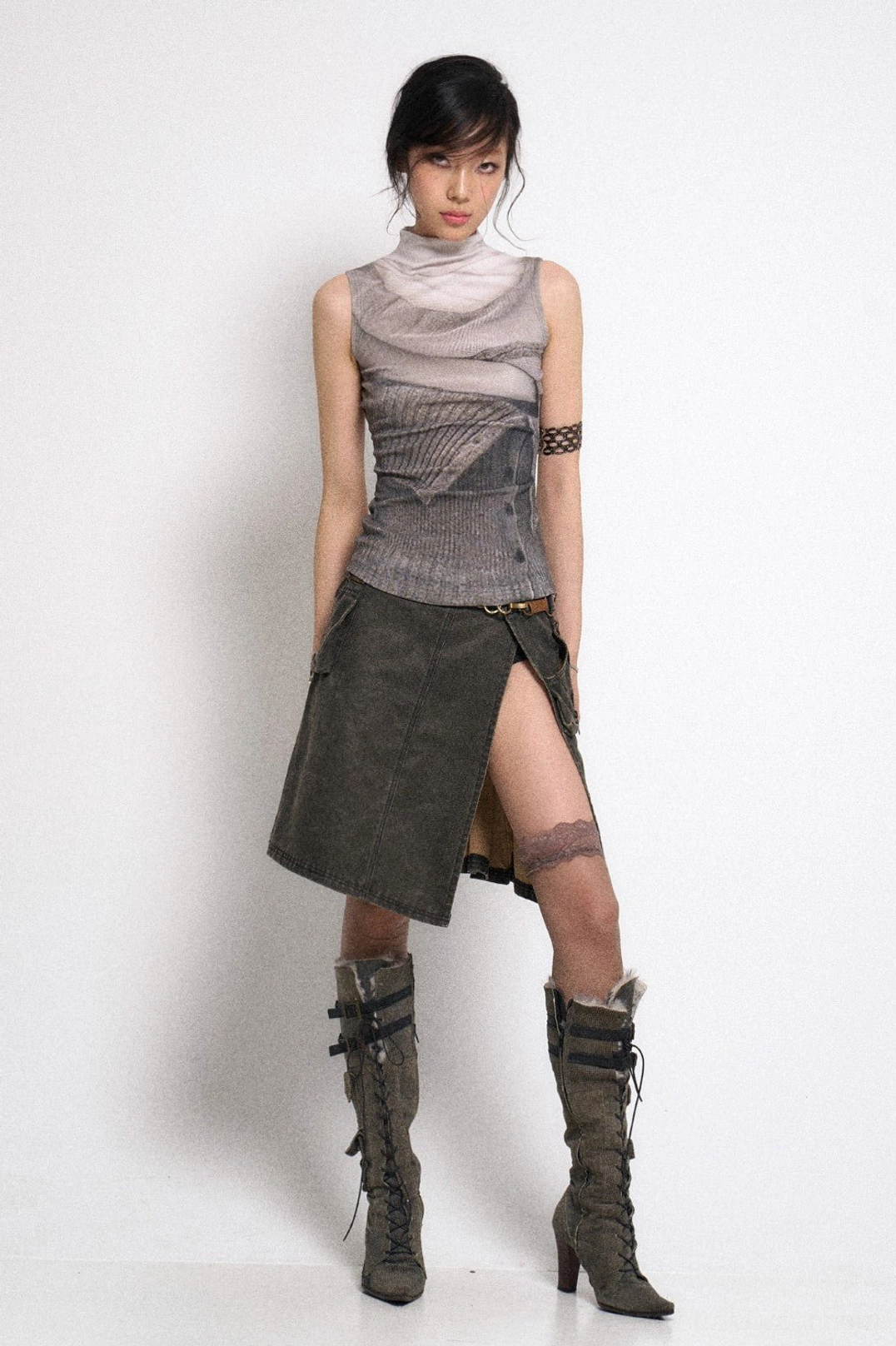 Distressed gray low rise gothic cargo mini skirt with dramatic side split and asymmetric pleated panels