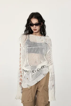 Front view of an off-white distressed hollow-out crochet sweater with asymmetric hem, ripped long sleeves, metal waist rings, and oversized streetwear fit