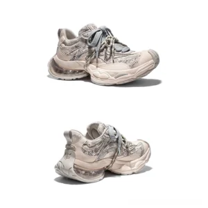 Three-quarter front view of distressed mesh air-cushion chunky sneakers with layered panels, thick laces and oversized streetwear sole
