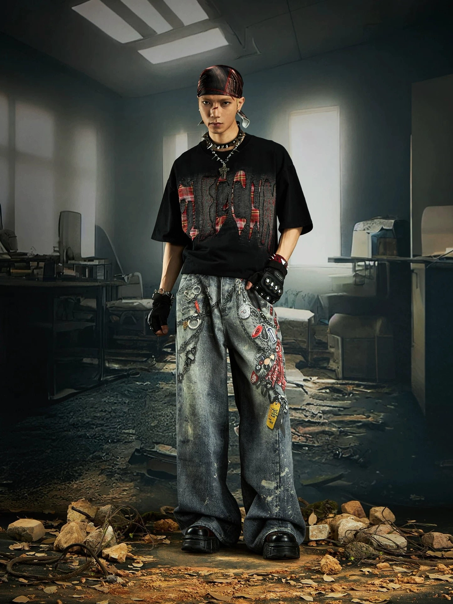Black distressed plaid slash oversized graphic streetwear tee shown in front and back styling views with wide-leg jeans