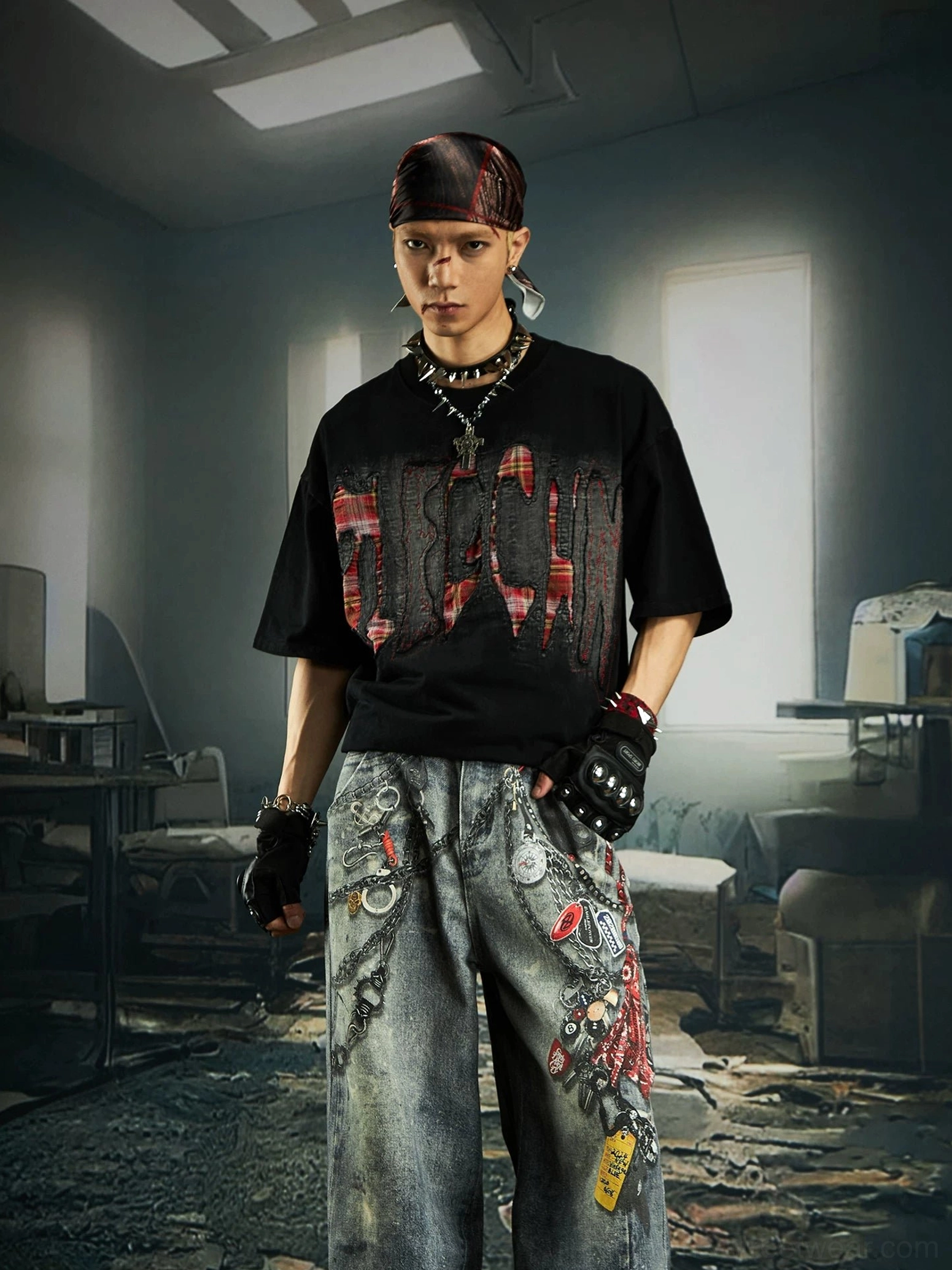 Full-body front view of black distressed plaid slash oversized graphic streetwear tee with embroidered wide-leg denim