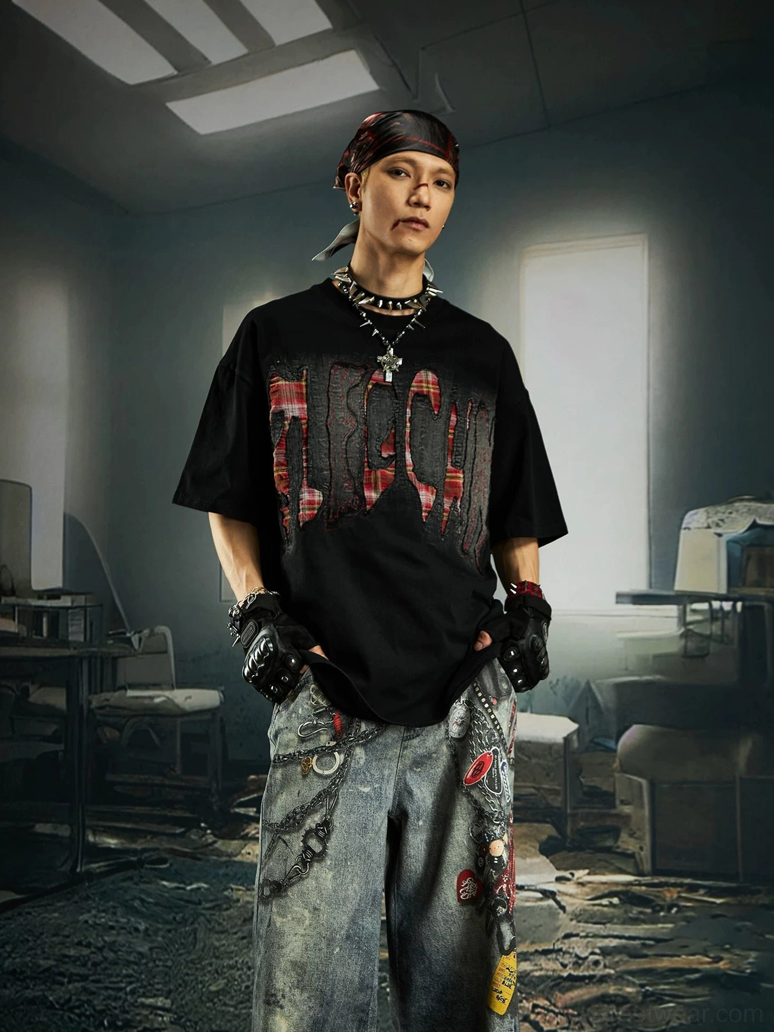 Black distressed plaid slash oversized graphic streetwear tee front view styled with layered chain necklaces