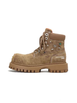 Khaki distressed platform combat boots shown in left side profile with textured upper metal stud details lace-up front and chunky lug sole