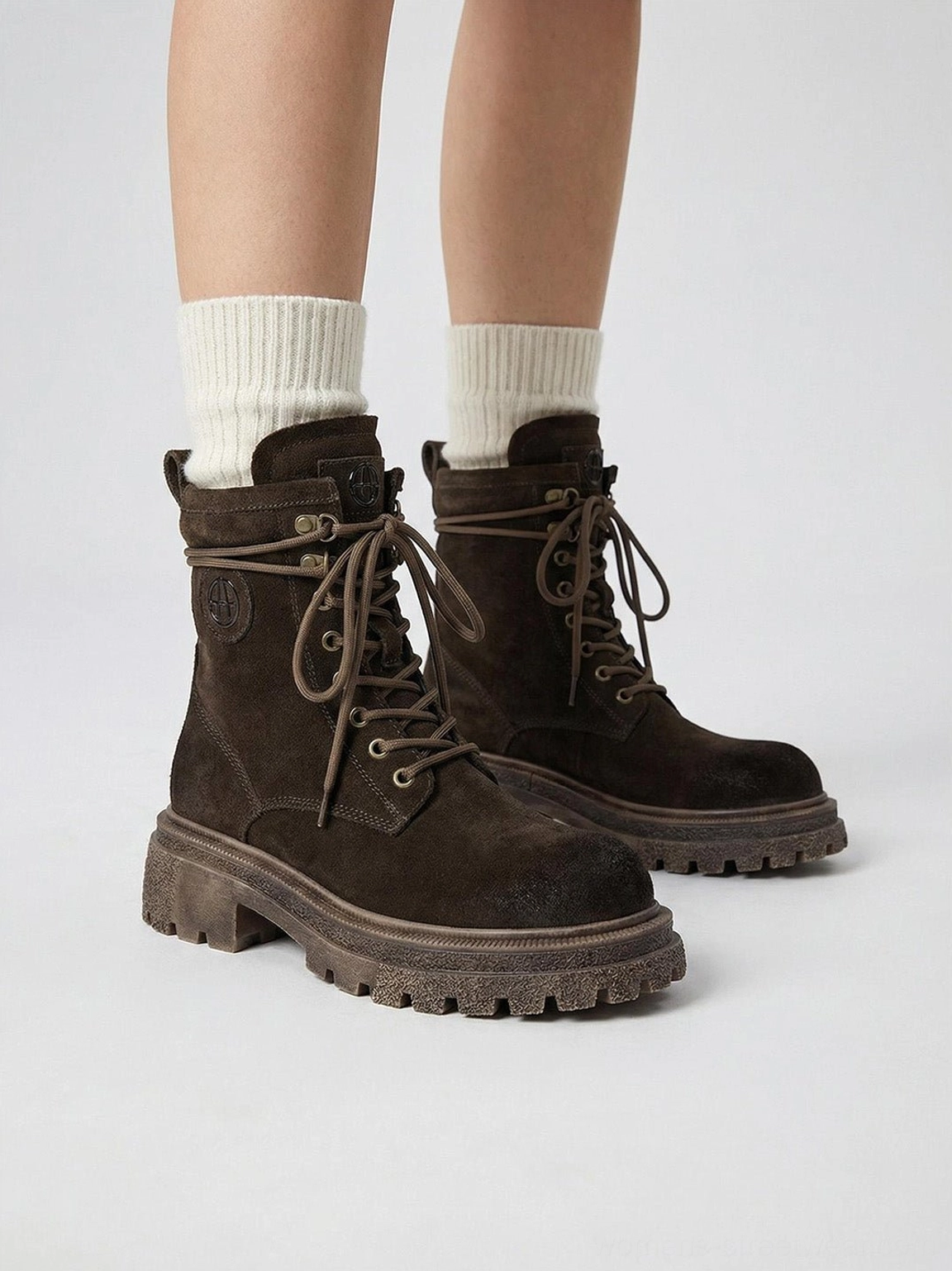 Distressed platform combat boots lifestyle shot model wearing boots in urban street environment gorpcore aesthetic