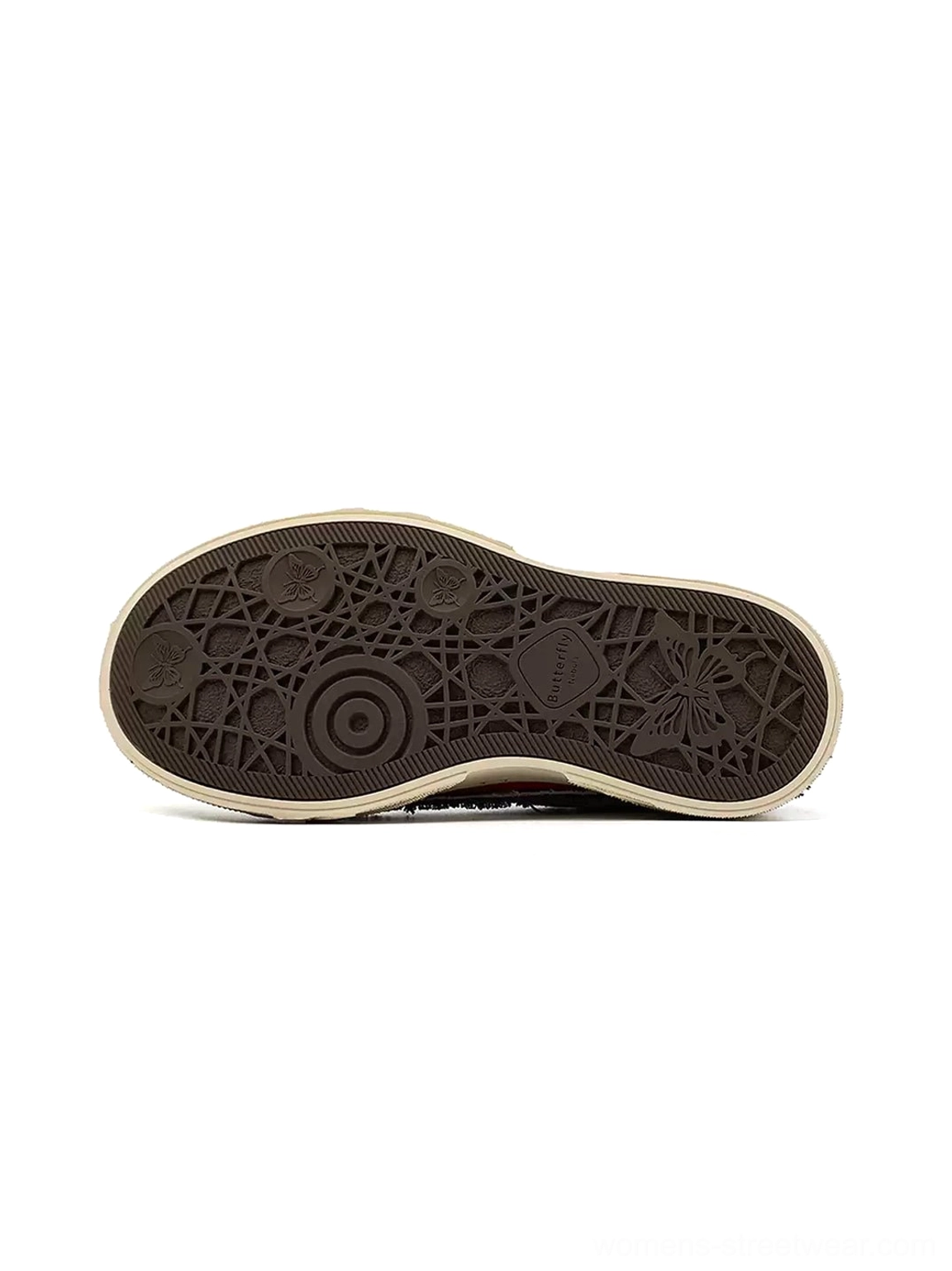 Bottom view of distressed platform sneakers showing cracked patterned rubber outsole and vintage worn tread