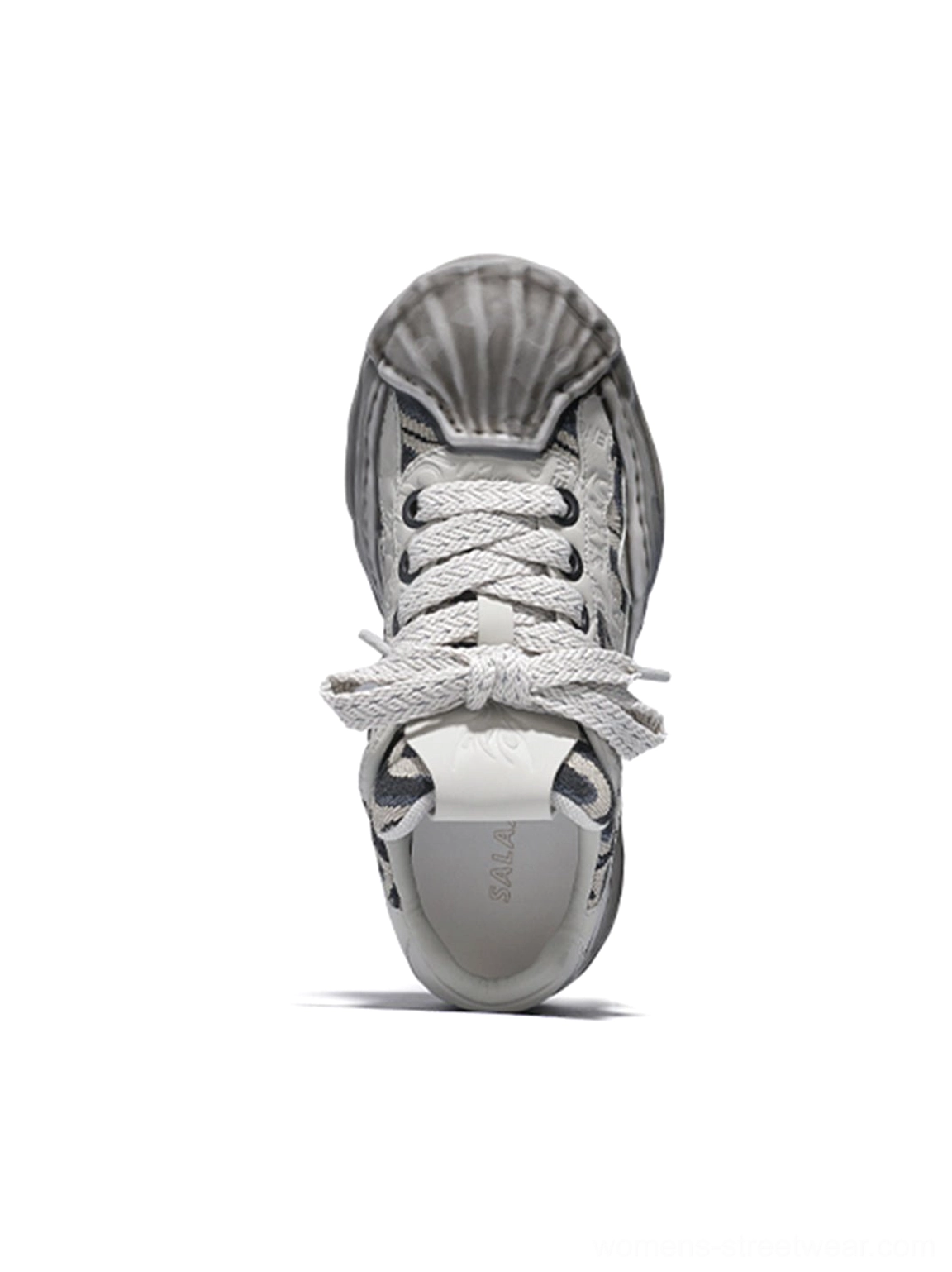 Top-down front view of a distressed shell-toe leather skate sneaker with molded toe cap, chunky flat laces, padded tongue, and branded heel tab