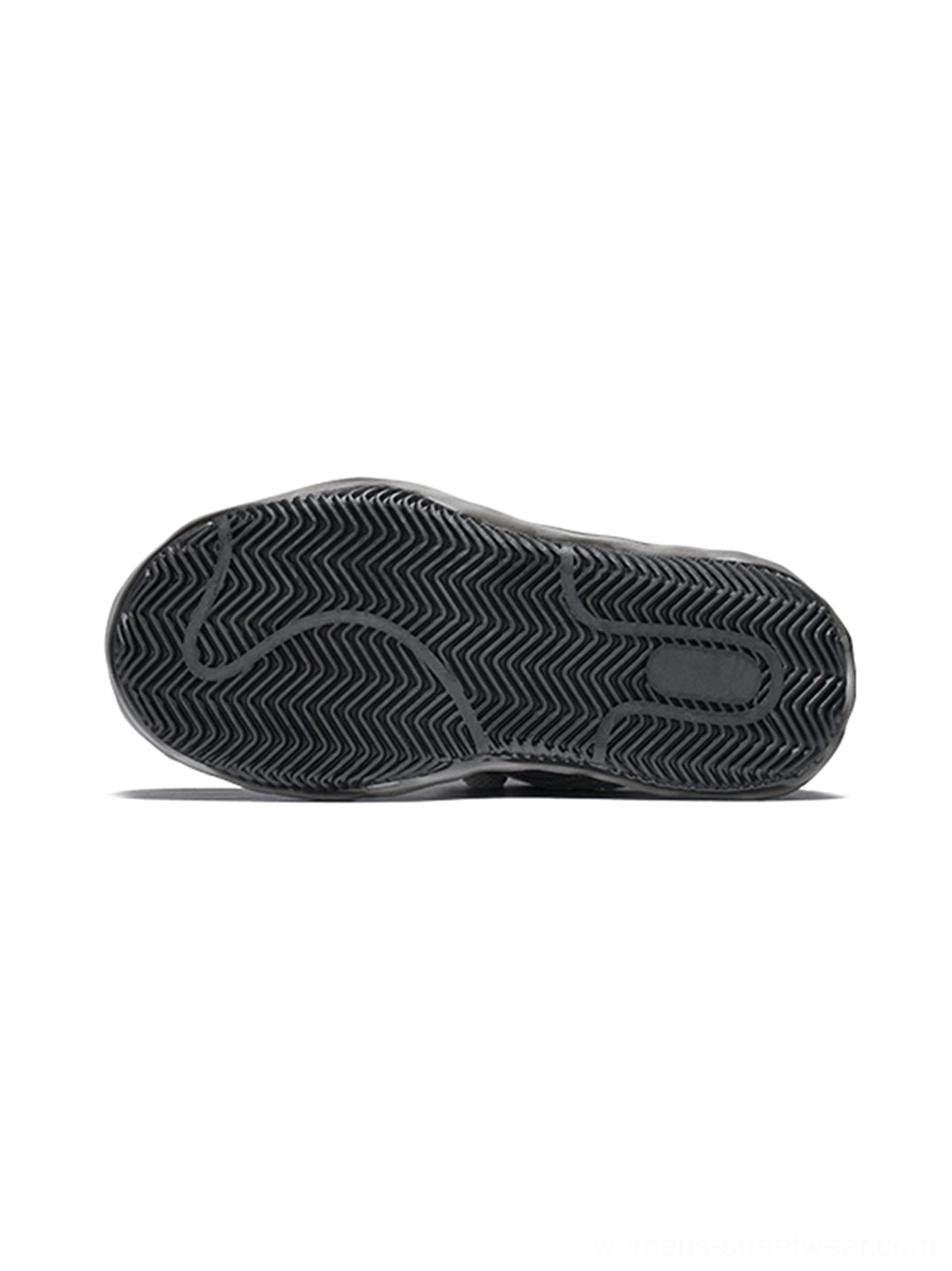 Bottom view of a distressed shell-toe leather skate sneaker showing the non-slip wavy rubber traction tread and thick sculpted outsole