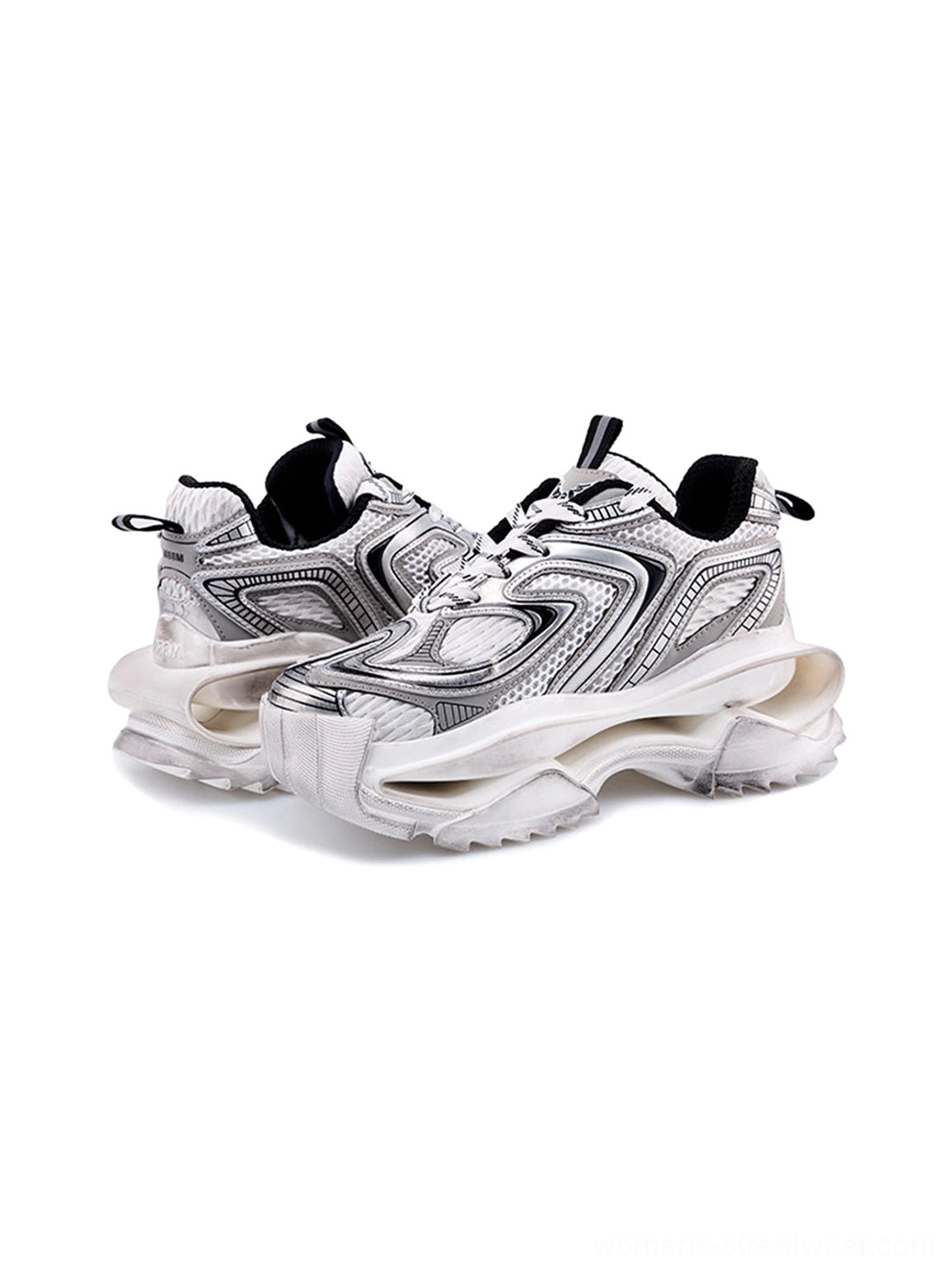 Pair of distressed silver sculpted sole chunky dad sneakers showing black lining heel pull tabs and layered outsole