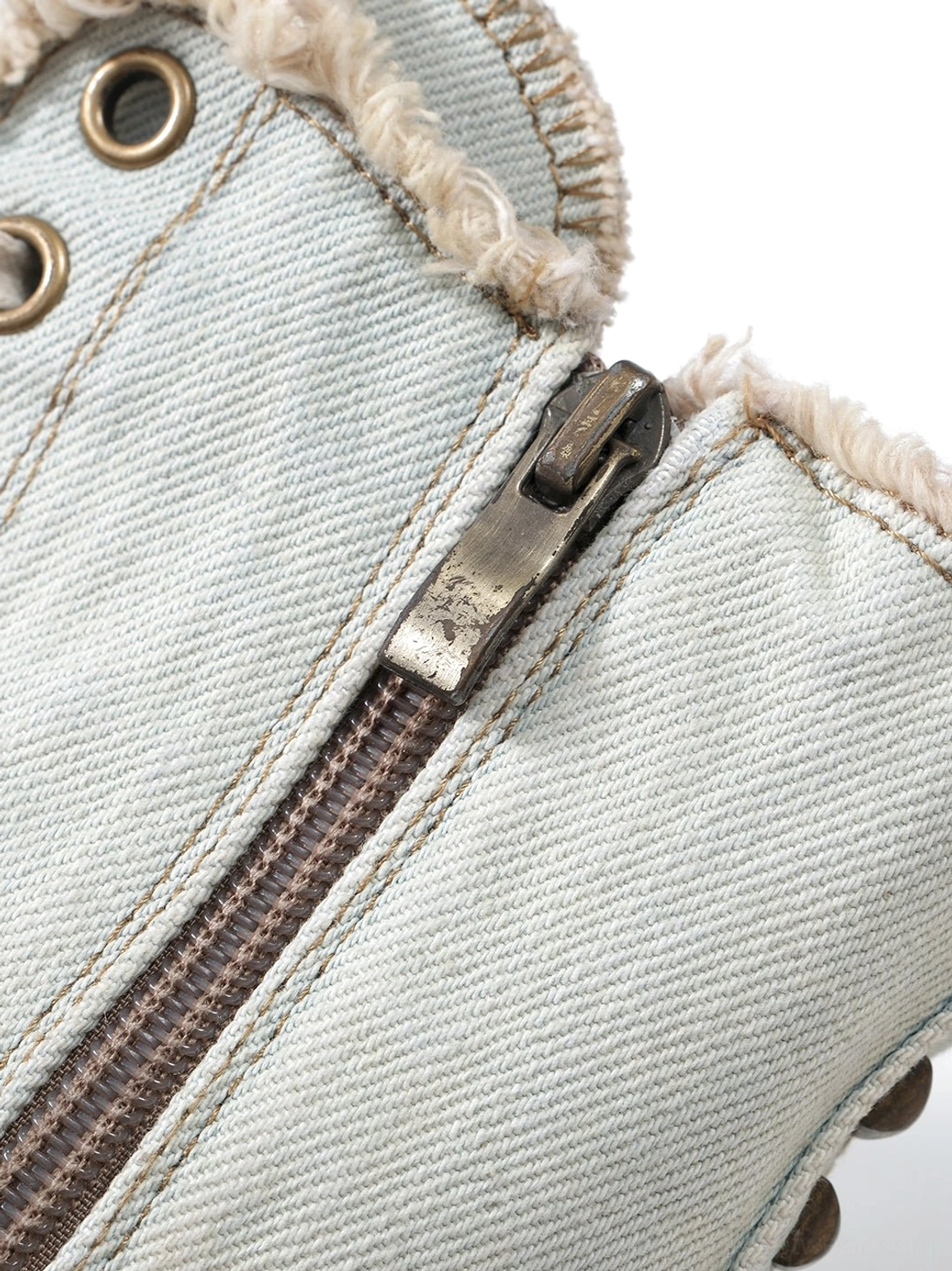 Denim platform stiletto boots with distressed edges, metal studs, and lace-up front styling
