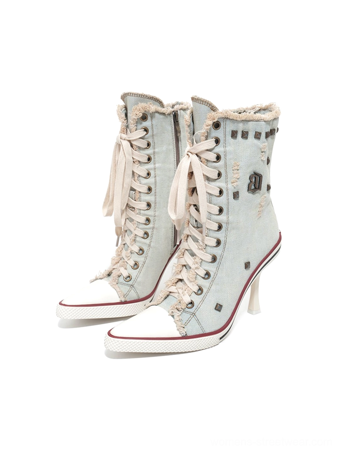 Pair of distressed studded denim platform stiletto boots shown from the front three-quarter angle