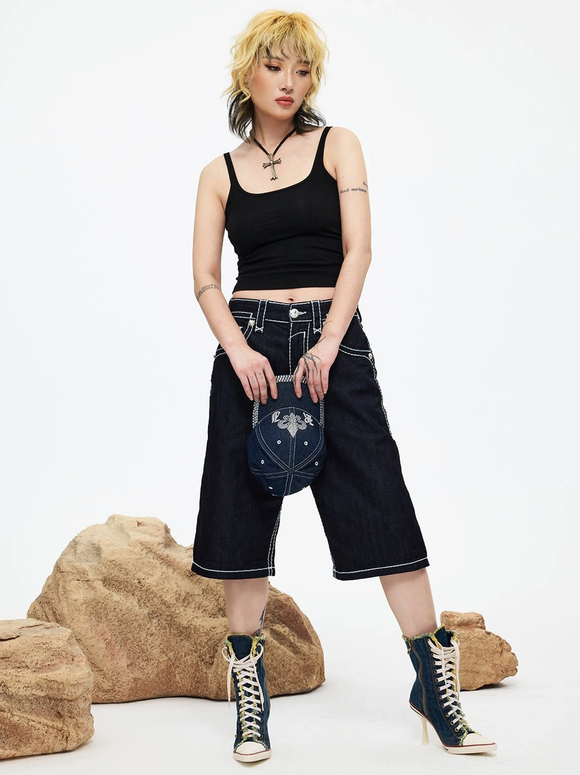 Washed denim stiletto platform boots featuring studded trim and a distressed streetwear finish