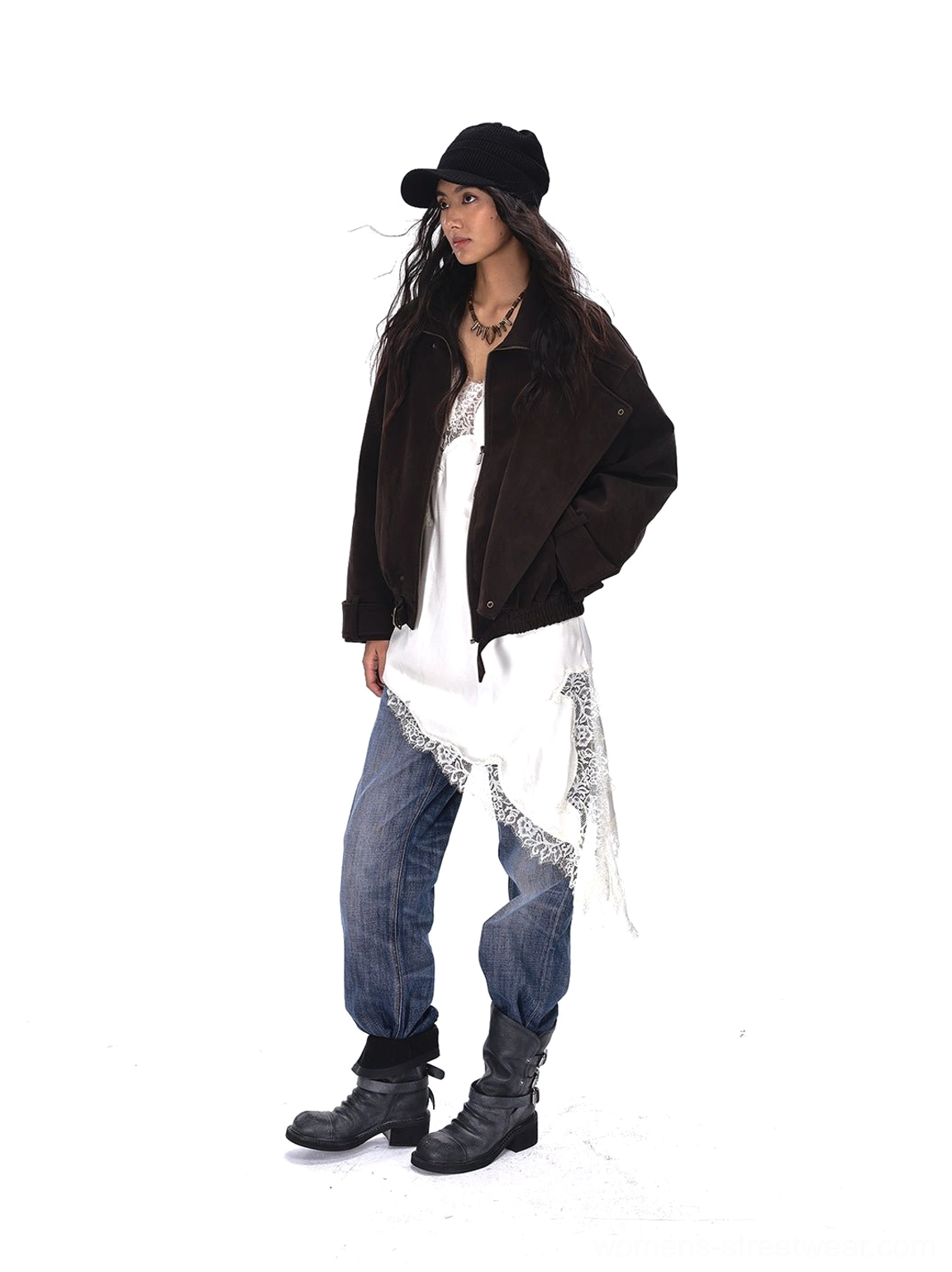 Full front view of distressed triple-buckle leather ankle boots styled with denim and cropped brown jacket