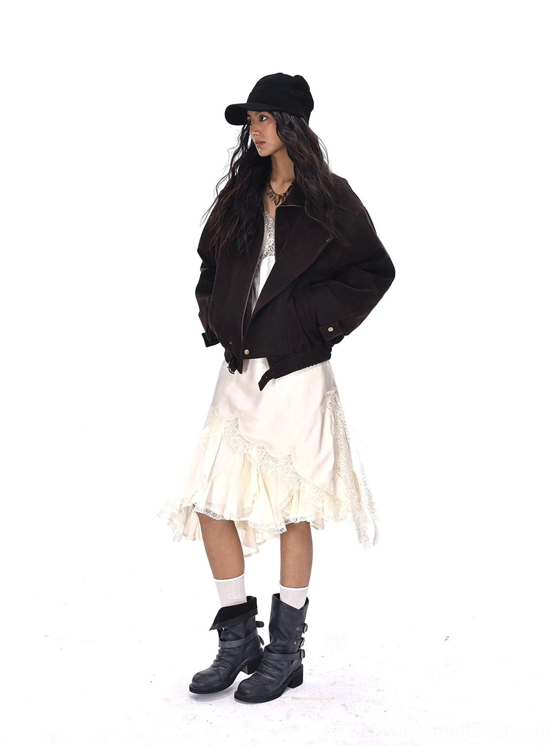 Full side outfit view of women’s distressed black triple-buckle ankle boots with feminine streetwear styling