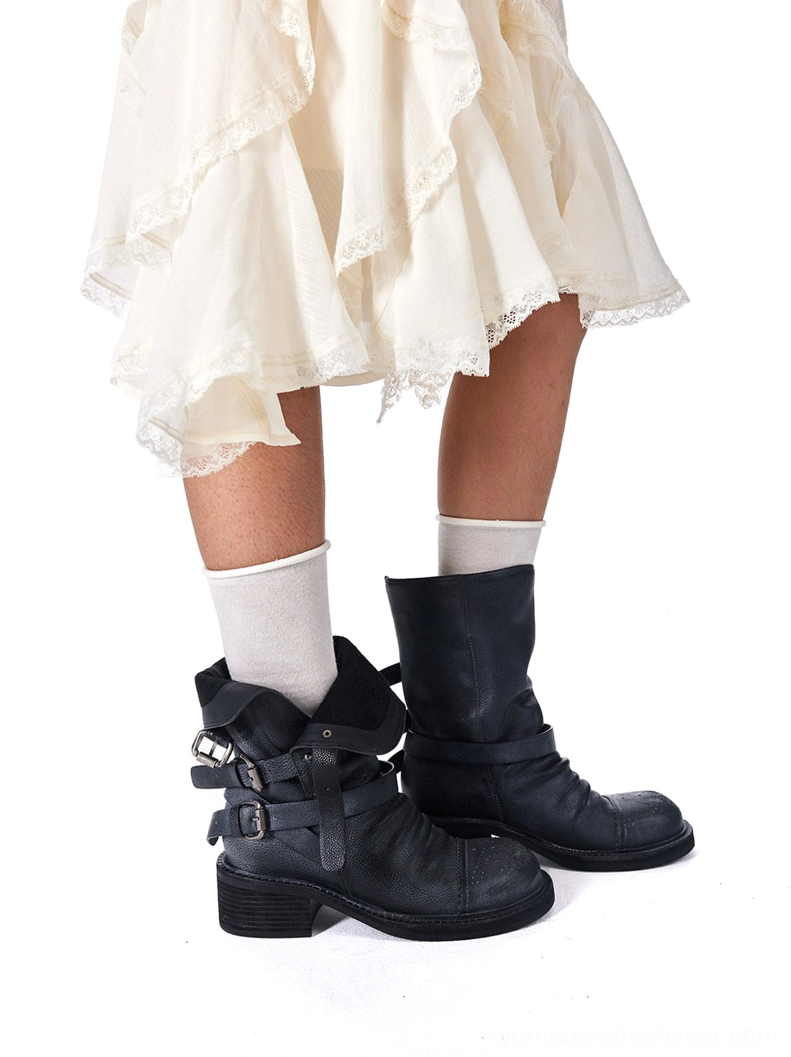 Low front view of women’s distressed triple-buckle leather ankle boots with square block heels