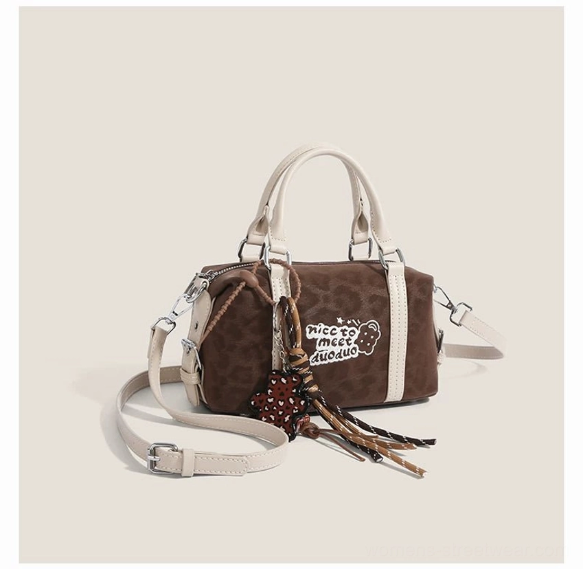 Dark leopard Doodle Charm mini barrel shoulder bag with bear slogan patch, gingerbread pendant, tassel and detachable strap