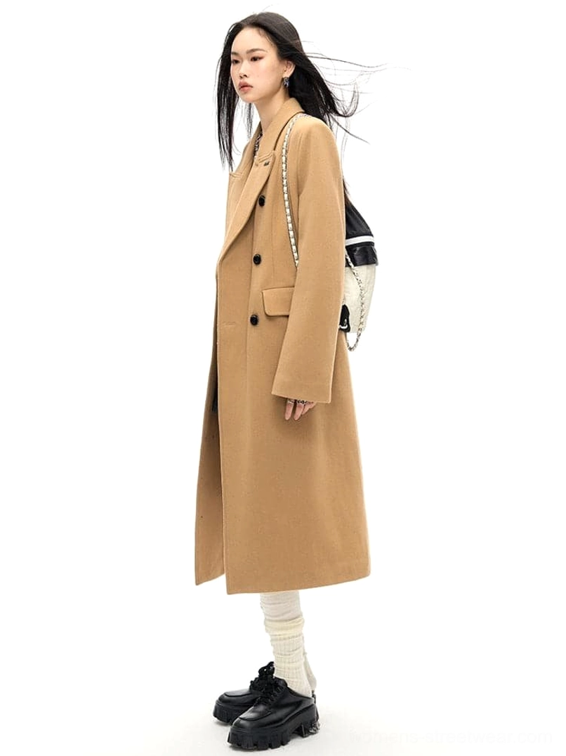 Double-breasted wool long coat with slim waist tailoring in a detailed fashion product view