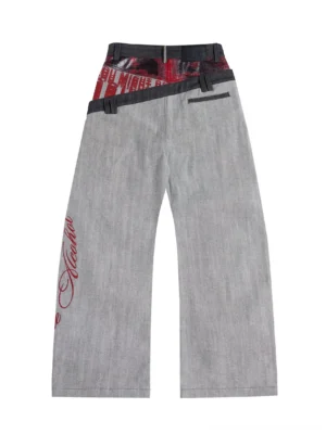 Back view of gray patchwork double-waist wide-leg jeans with printed waistband text back pocket strap and red cursive leg graphic