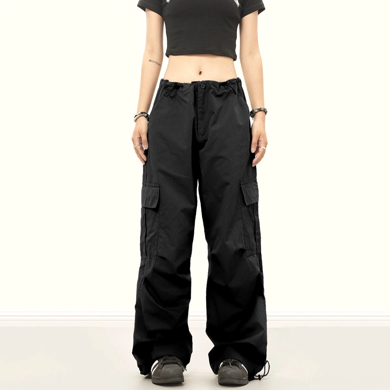 Downtown baggy streetwear cargo pants with wide-leg utility silhouette, adjustable drawstring waist and cinchable ankle cuffs