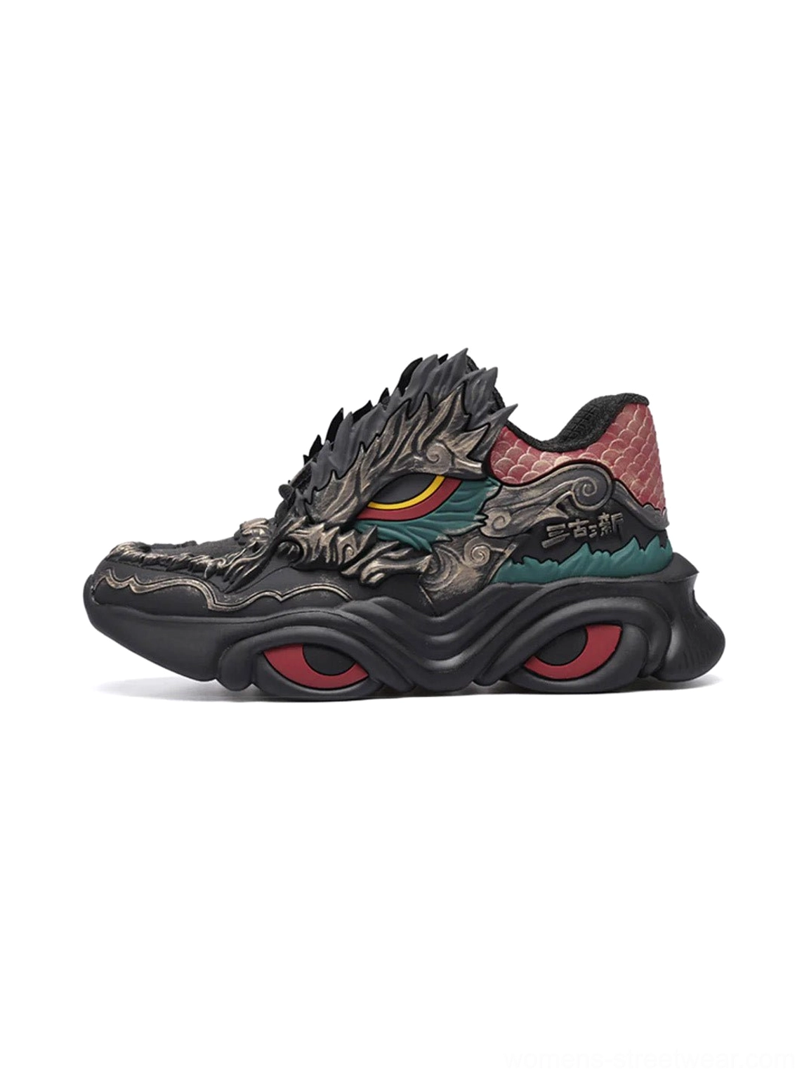 Black dragon crest chunky runner sneakers shown from the left side with metallic dragon detailing, red circular sole accents, and teal decorative trims