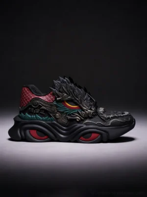 Black dragon crest chunky sneakers in a three-quarter studio view with a raised dragon head toe ornament, red heel panel, and cushioned wave sole
