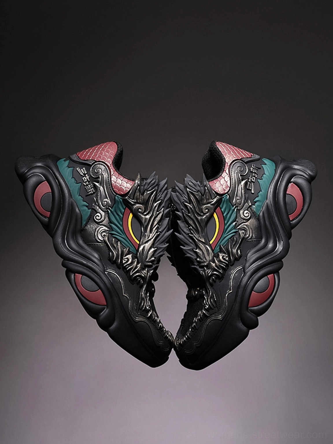 Rear overhead view of black dragon chunky runner sneakers with symmetrical red scaled heel panels, dragon-inspired detailing, and matching chunky soles