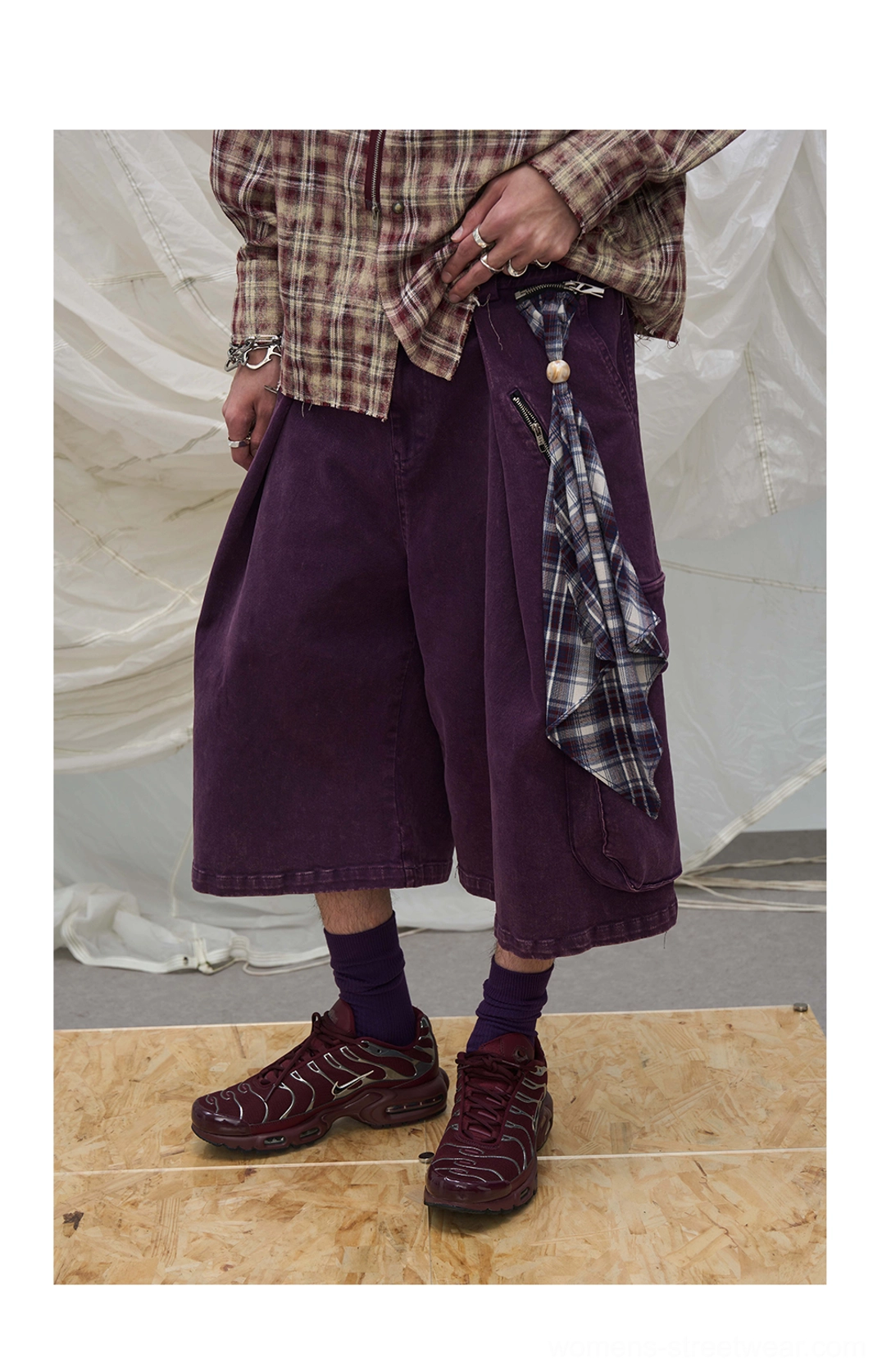 Oversized cargo culotte shorts with layered scarf accent, washed fabric finish, and contemporary Y2K streetwear appeal