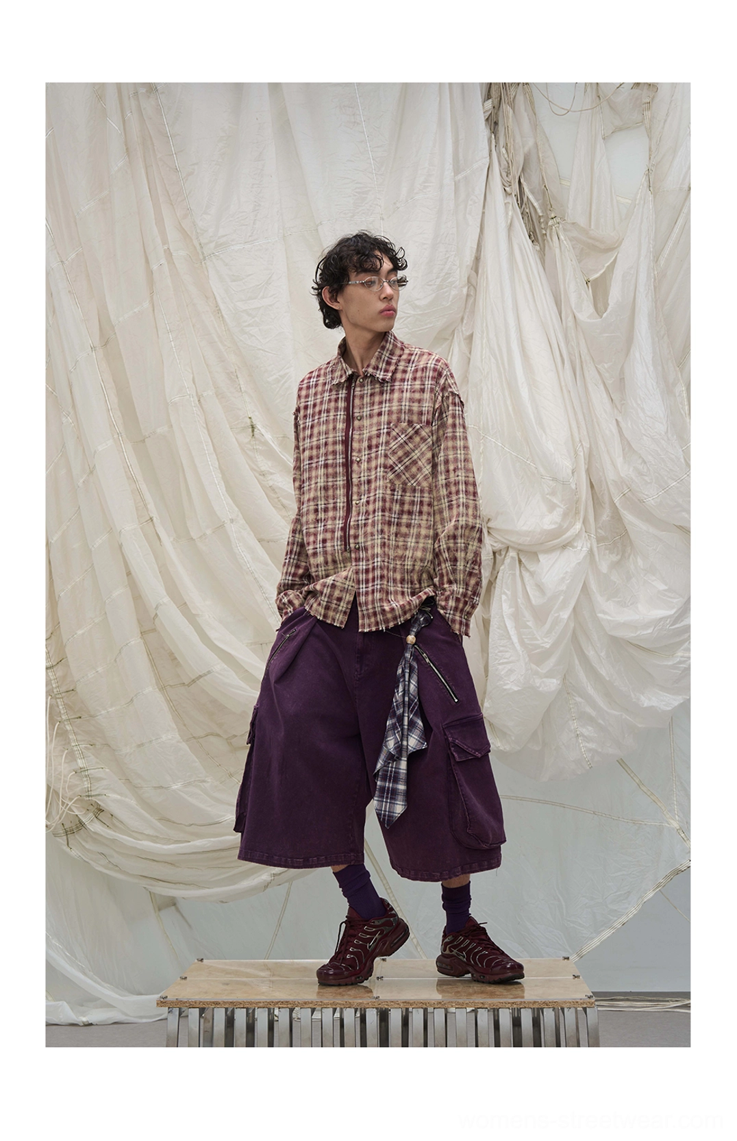 Streetwear cargo culotte shorts with vintage washed finish, oversized utility pockets, and distinctive scarf styling