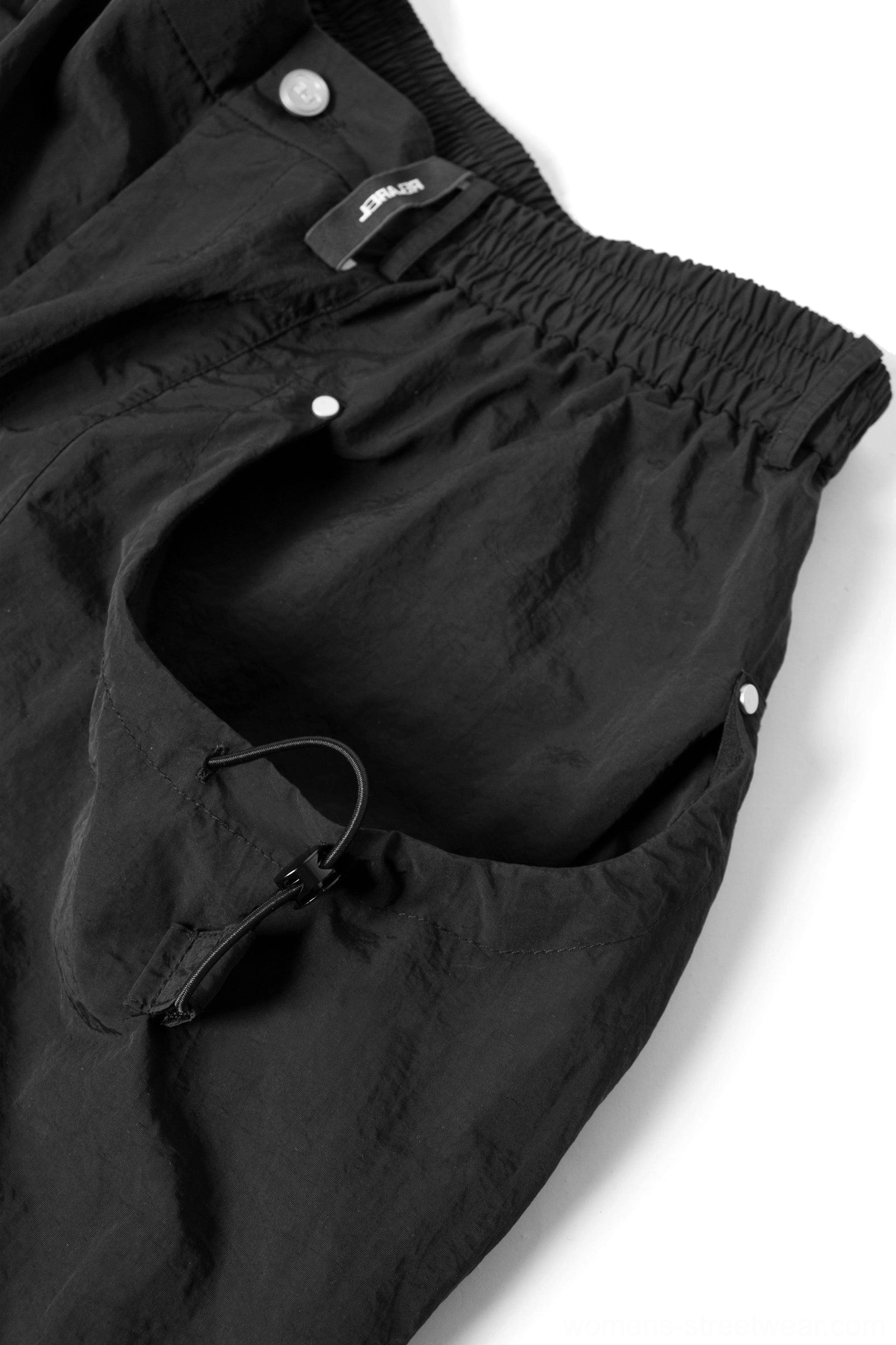 Drawstring wide leg utility pants with oversized cargo pockets and technical streetwear construction