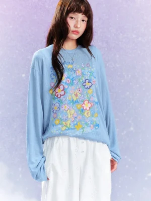 Blue Dream Garden floral graphic long sleeve streetwear tee styled with white wide leg pants