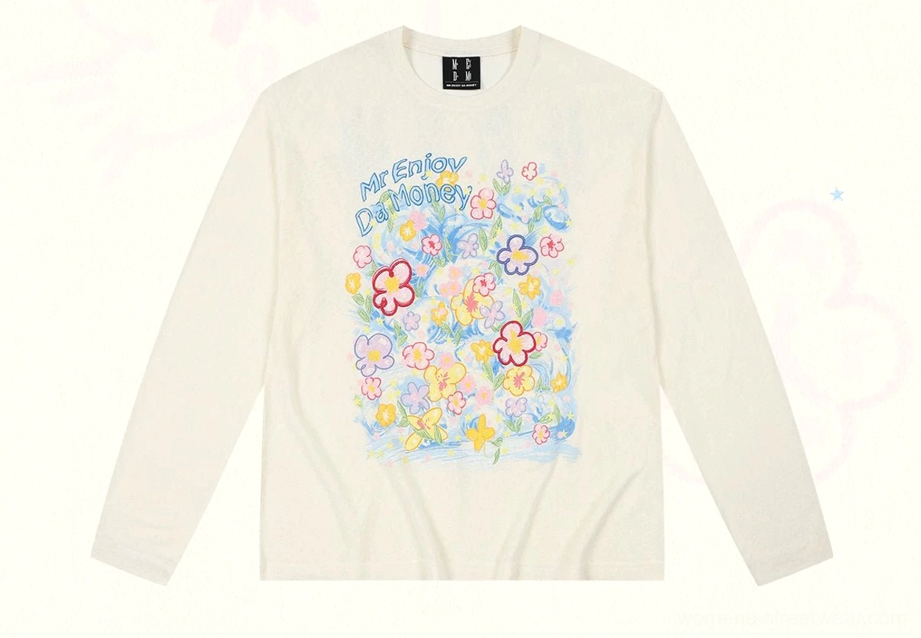 Cream Dream Garden floral graphic long sleeve streetwear tee front flat lay with colorful flower print