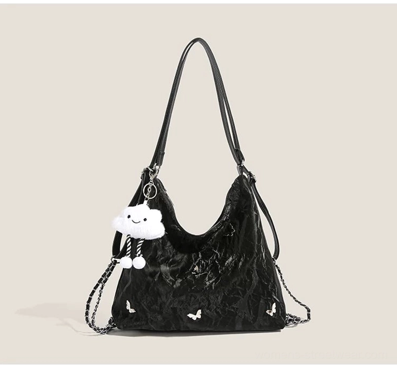 Black dreamy cloud charm butterfly slouchy hobo shoulder bag with adjustable straps and metallic chain details