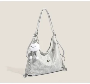 Silver dreamy cloud charm butterfly slouchy hobo shoulder bag with crinkled glossy texture and chain strap front view