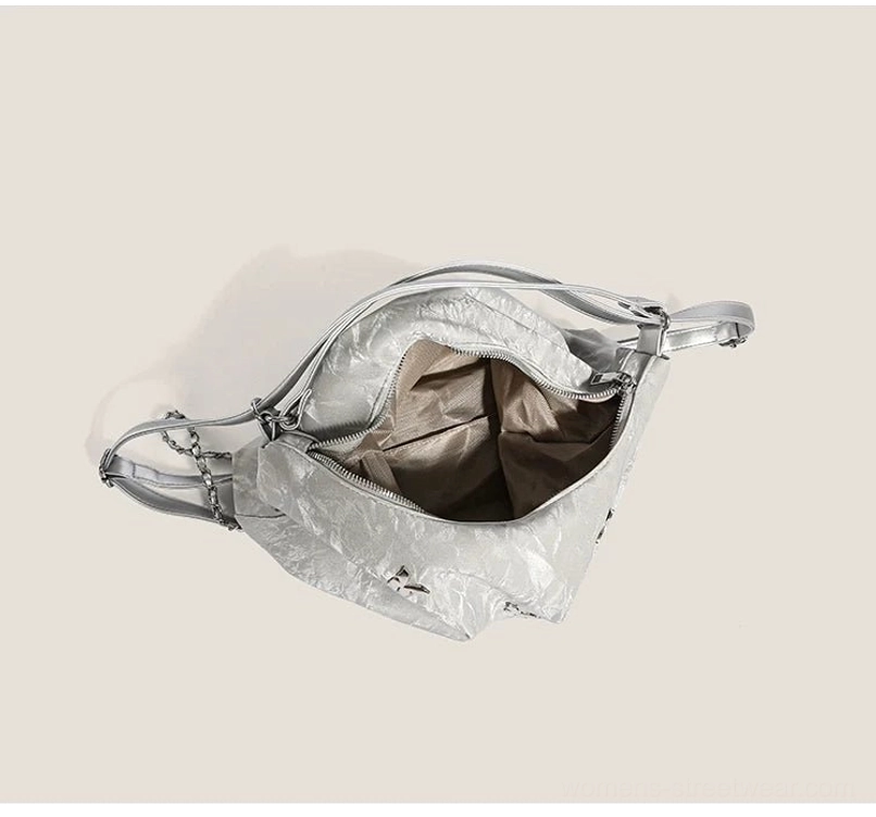 Open silver butterfly slouchy hobo shoulder bag showing polyester lined interior zippered main compartment and cloud charm