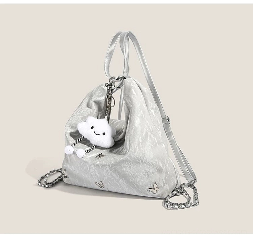 Silver butterfly cloud charm hobo bag open top view with crinkled synthetic exterior chain strap and soft slouchy shape
