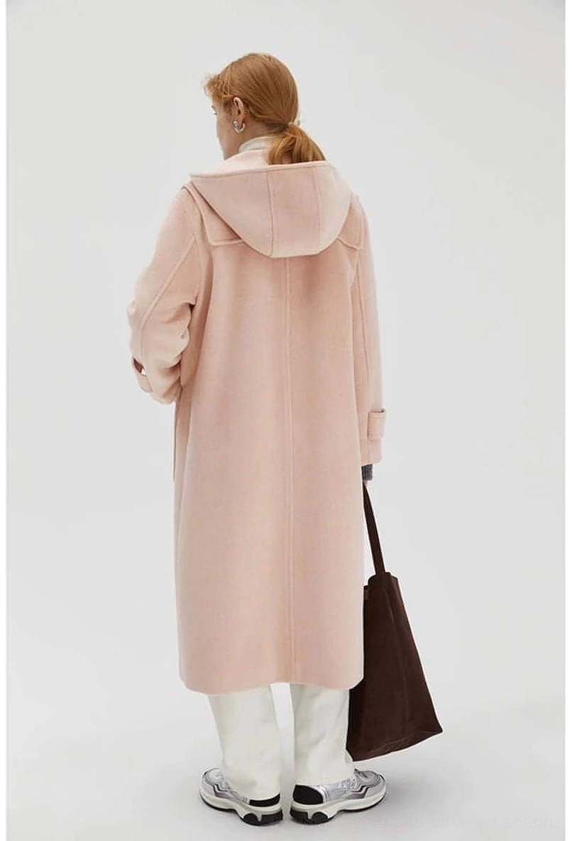 Wool duffle coat detail showing button placements along front closure and cuff areas