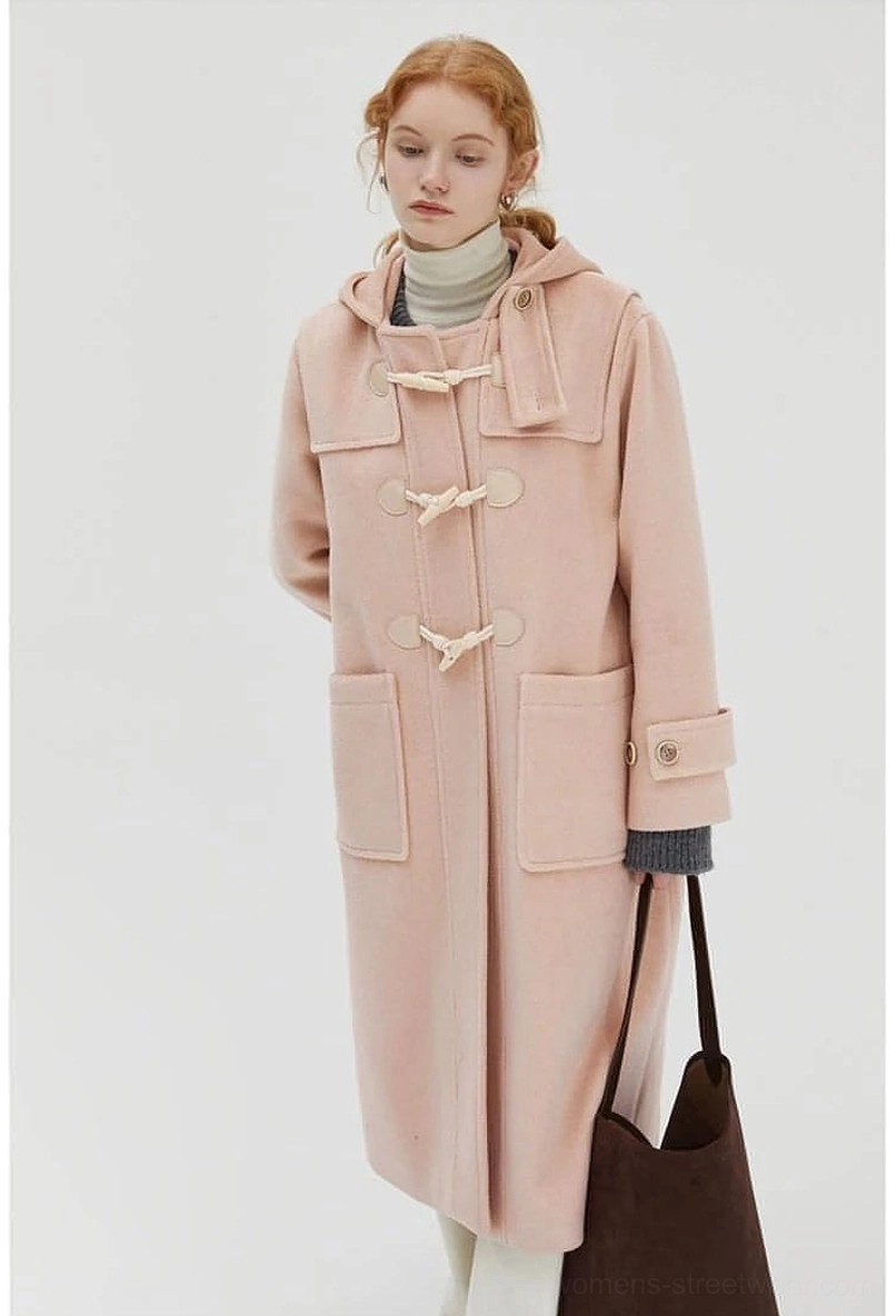 Duffle coat full body worn model walking pose demonstrating functionality and street style appeal