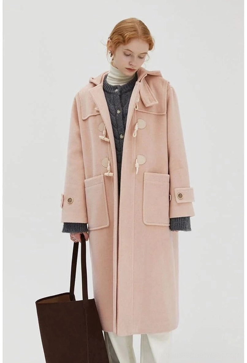 Model wearing wool duffle coat side profile view showing silhouette and mid-length cut