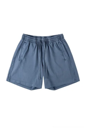 Dusty blue washed cotton oversized streetwear shorts with elastic drawstring waist relaxed straight leg and side pockets