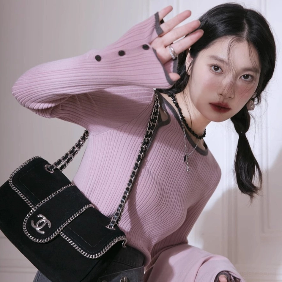 Dusty pink ribbed knit top with shoulder cutout and buttoned cuffs Korean fashion styling view