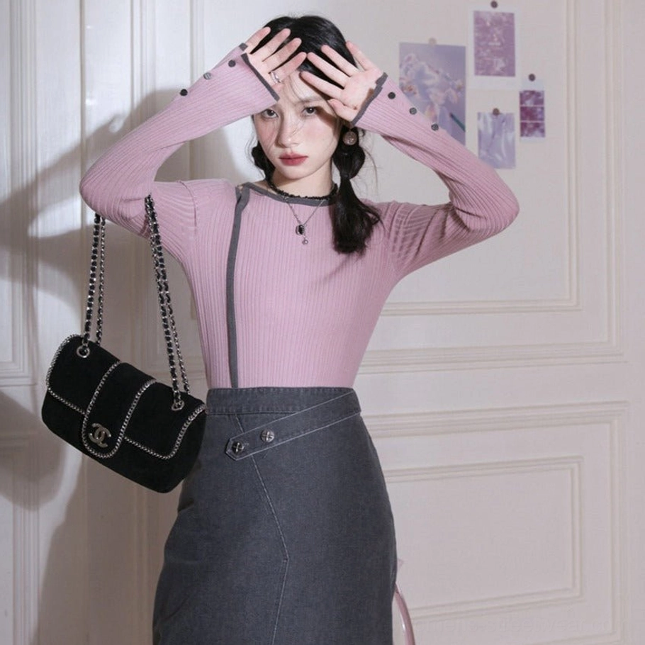 Dusty pink long sleeve ribbed knit top with charcoal contrast round neck and button cuff detail