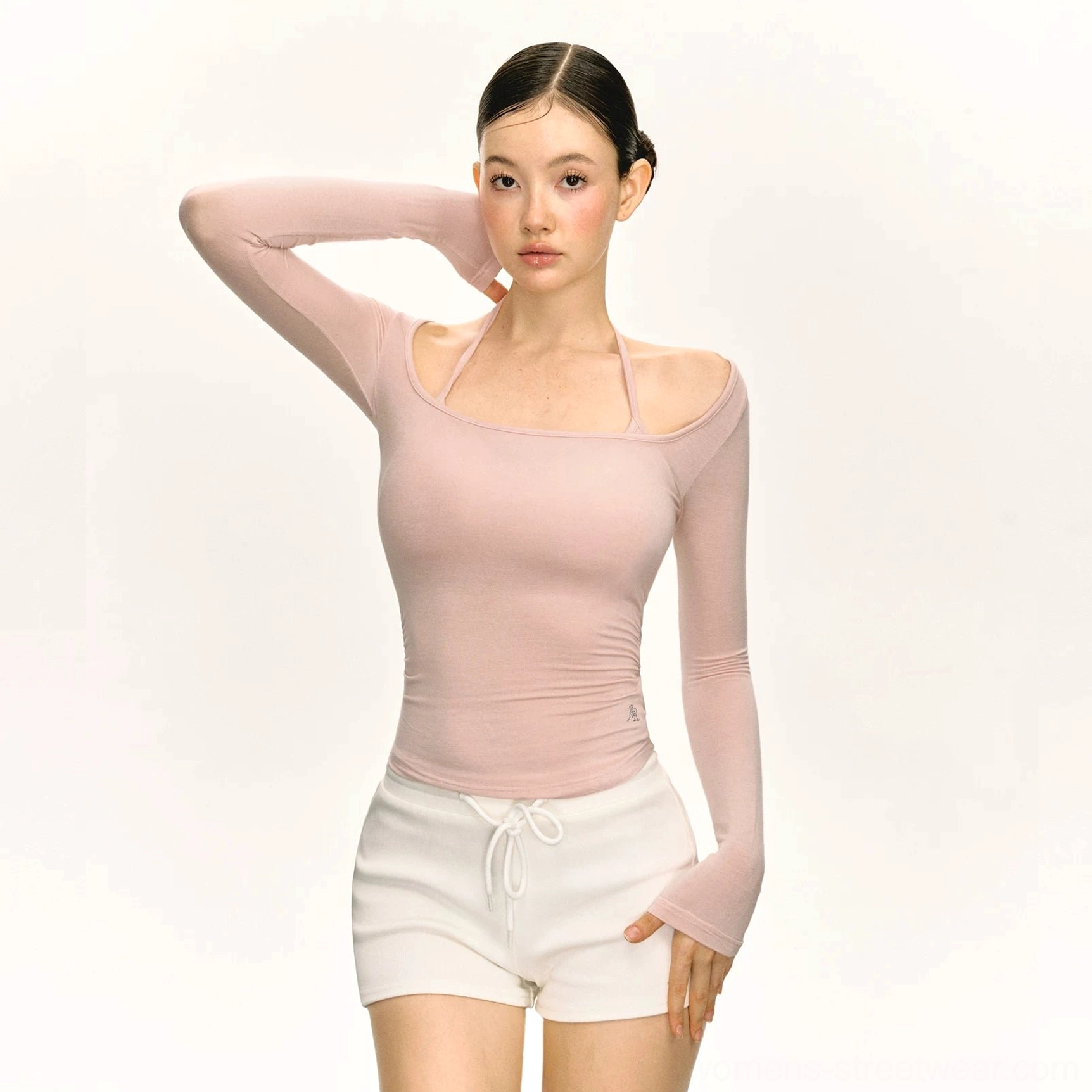 Dusty pink double strap scoop neck fitted long sleeve Y2K top paired with white low-rise drawstring shorts