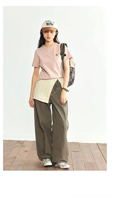 Dusty pink minimalist embroidered logo crew neck t-shirt full body front view cargo pants backpack