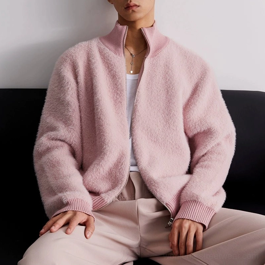 Dusty pink fuzzy fleece zip-up cardigan shown open over a white undershirt with ribbed trim detail