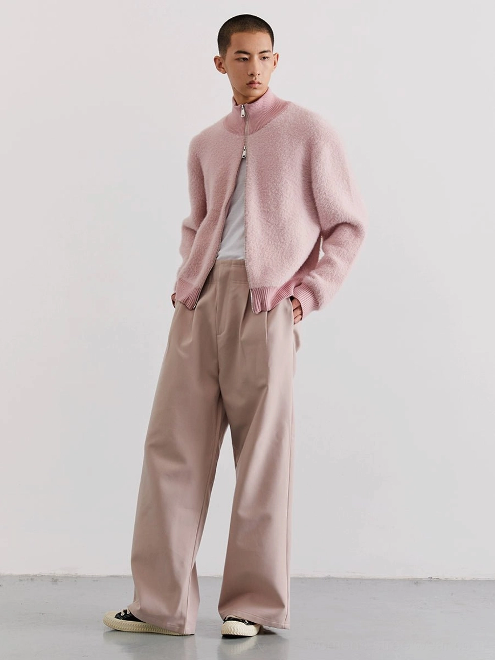 Dusty pink fuzzy zip-up fleece cardigan side view styled with wide-leg khaki pants in Korean streetwear look