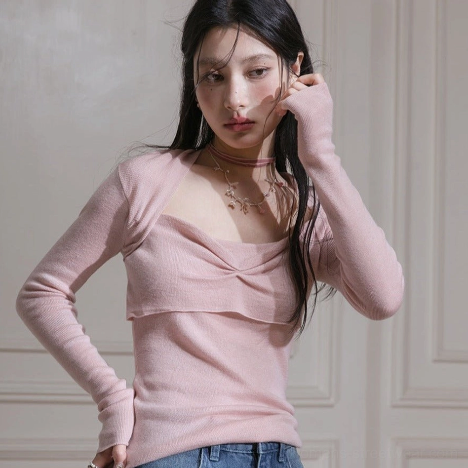 Dusty pink ribbed twist front long sleeve top styled with high waisted blue denim and layered necklaces