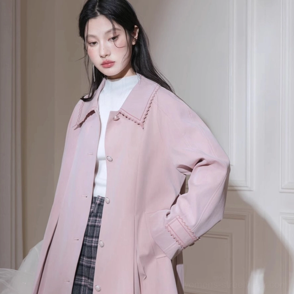 Dusty pink scalloped collar pleated hem belted trench coat fashion detail view