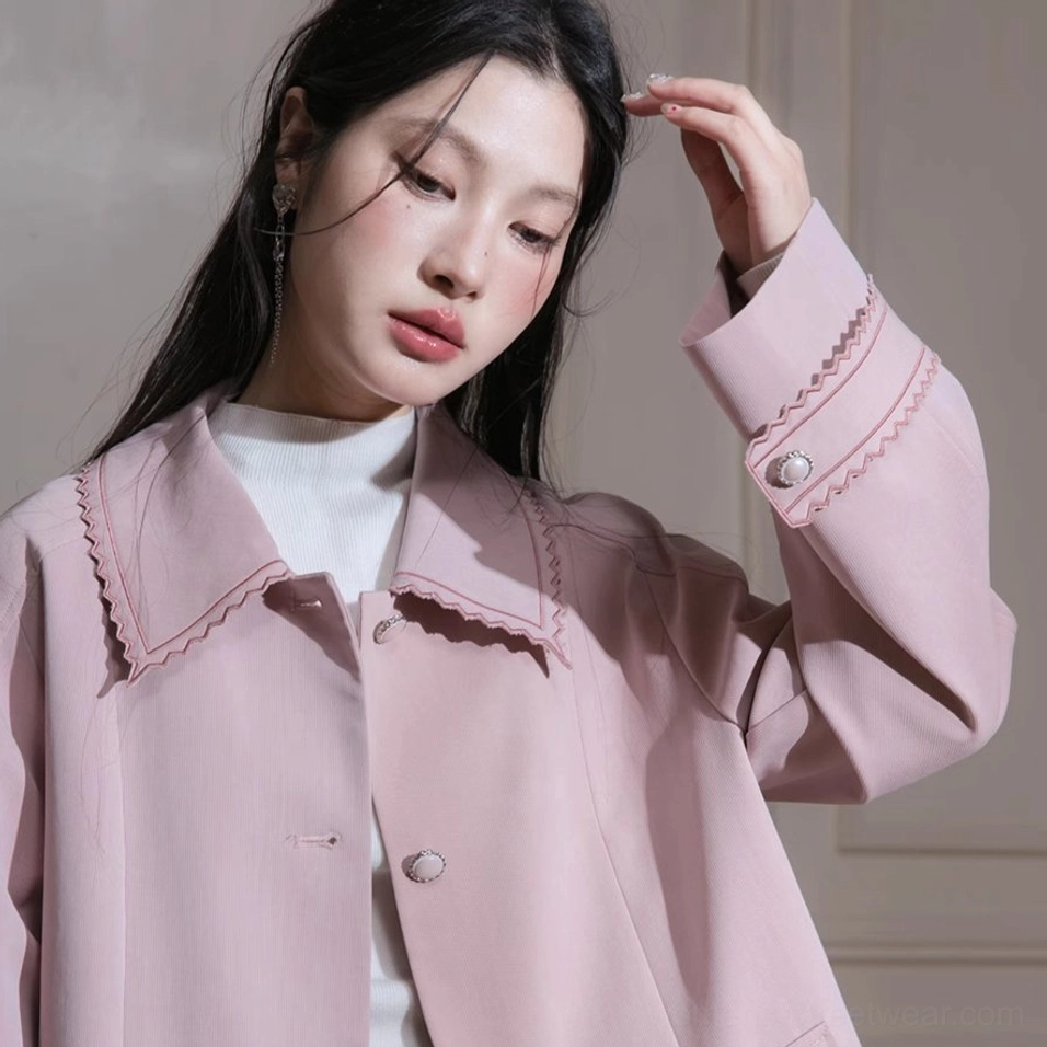 Dusty pink scalloped collar pleated hem belted trench coat tailored outerwear detail